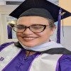Raven in graduation robe and cap