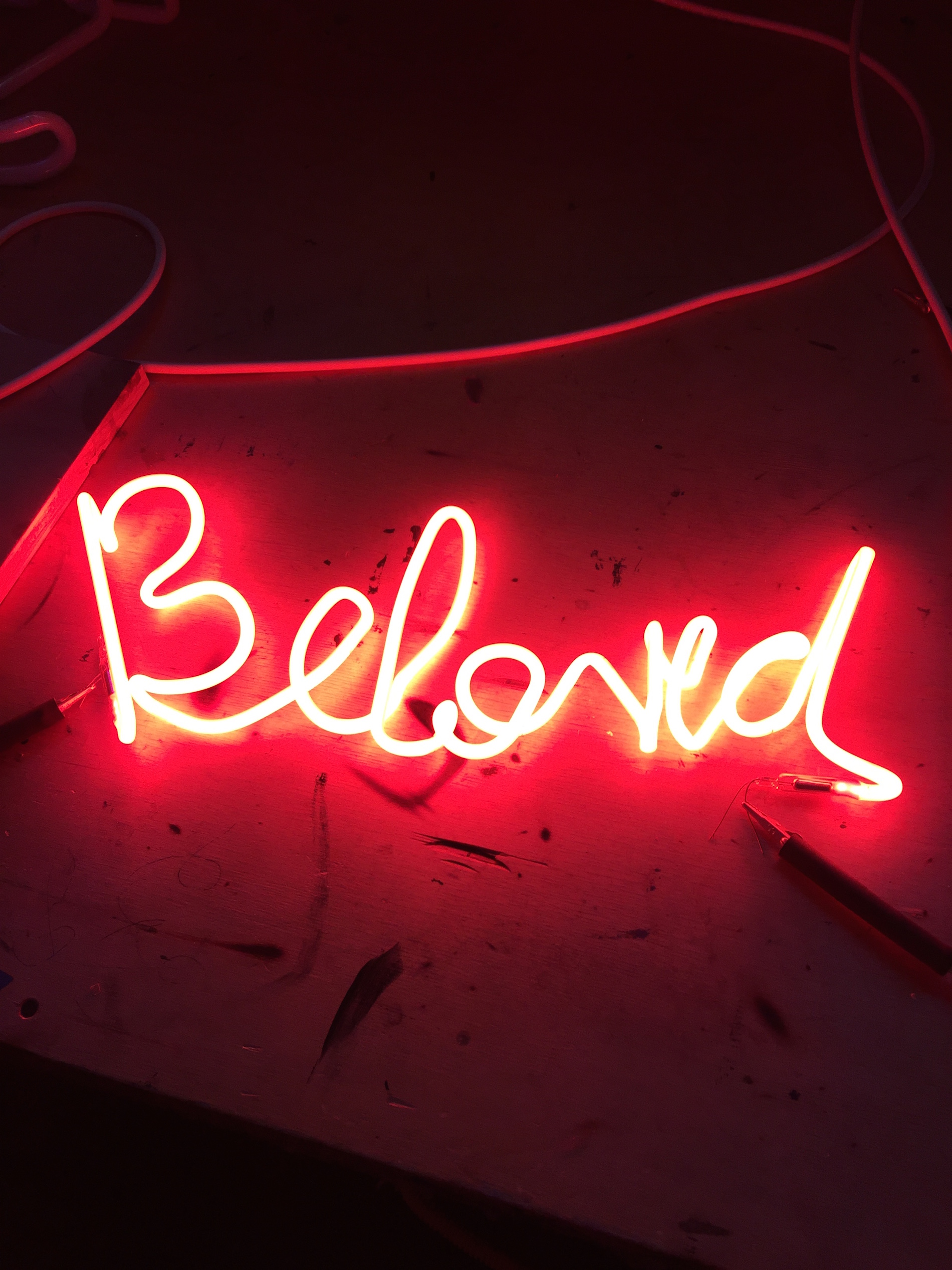 neon light depicts word "beloved"