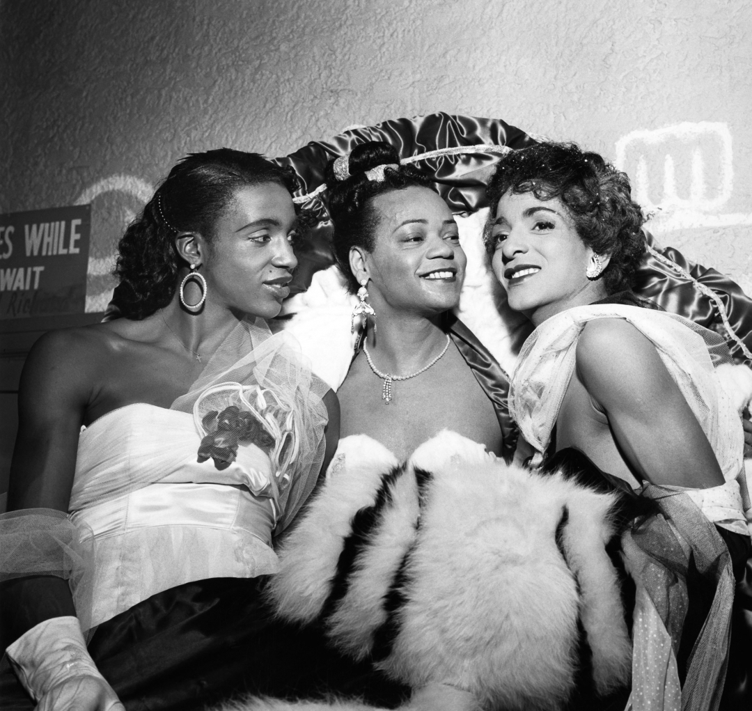 1954 Funmakers Ball participants Eddie McClennon, Bobbie Laney, 1st place winner for “Best Costume’ and Toni Evans pose for a photo. The annual event was held at the Rockland Palace in New York. (G. Marshall Wilson/EBONY Collection)