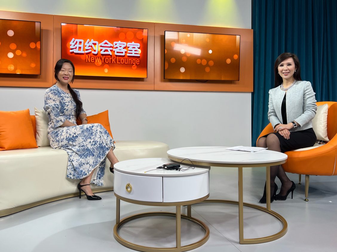 Professor Snow Yunxue Fu sits down for an interview across from New York Lounge host Lin Tan on talk show set