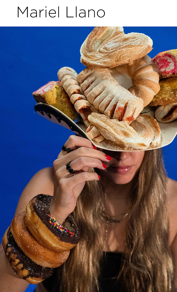 studio portrait of woman with food on her head and arms