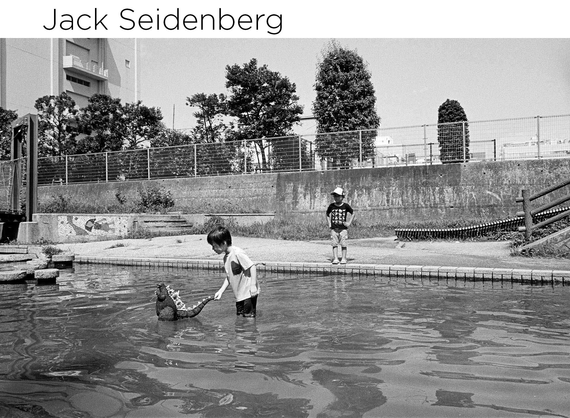 black and white photo of children playing in water