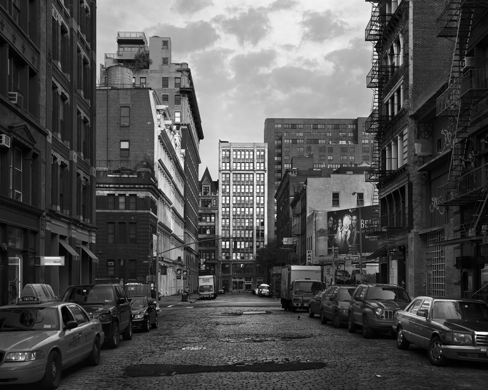 b&w image of nyc street with cobblestones
