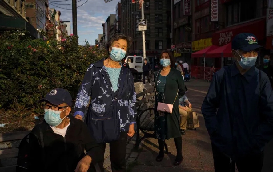 people wearing masks in chinatown