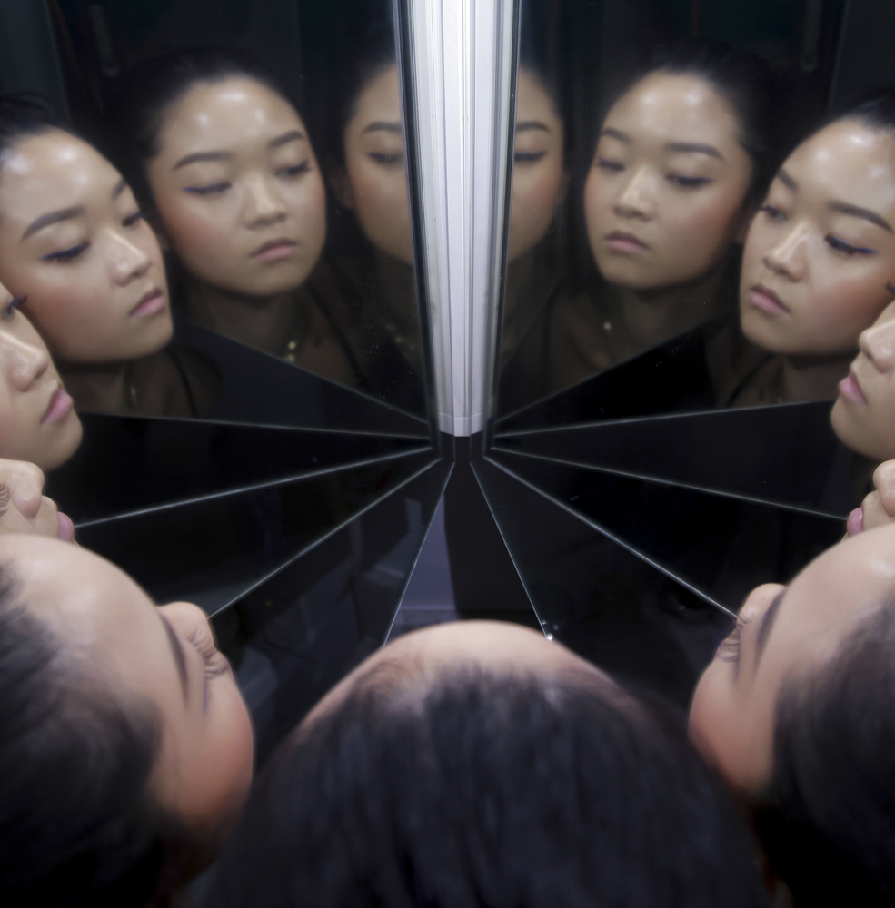 portrait of a woman with reflections in mirrors 