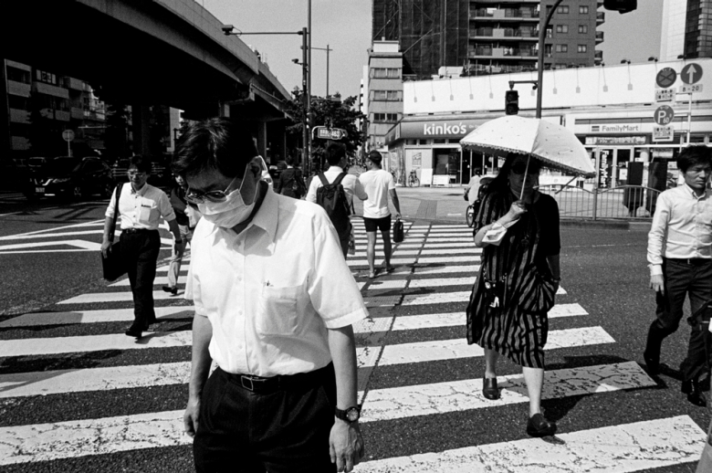 black and white photo of street scene in Japan