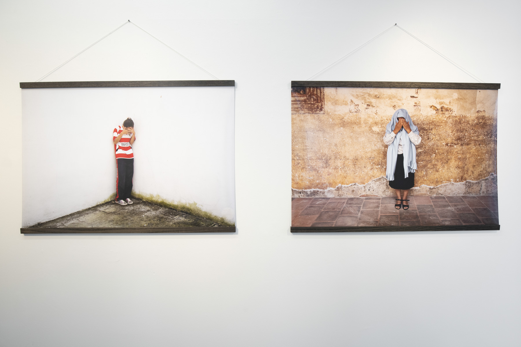 Installaton shot 3 of 6 - framed works by paul owen detail portraits of women in mexico