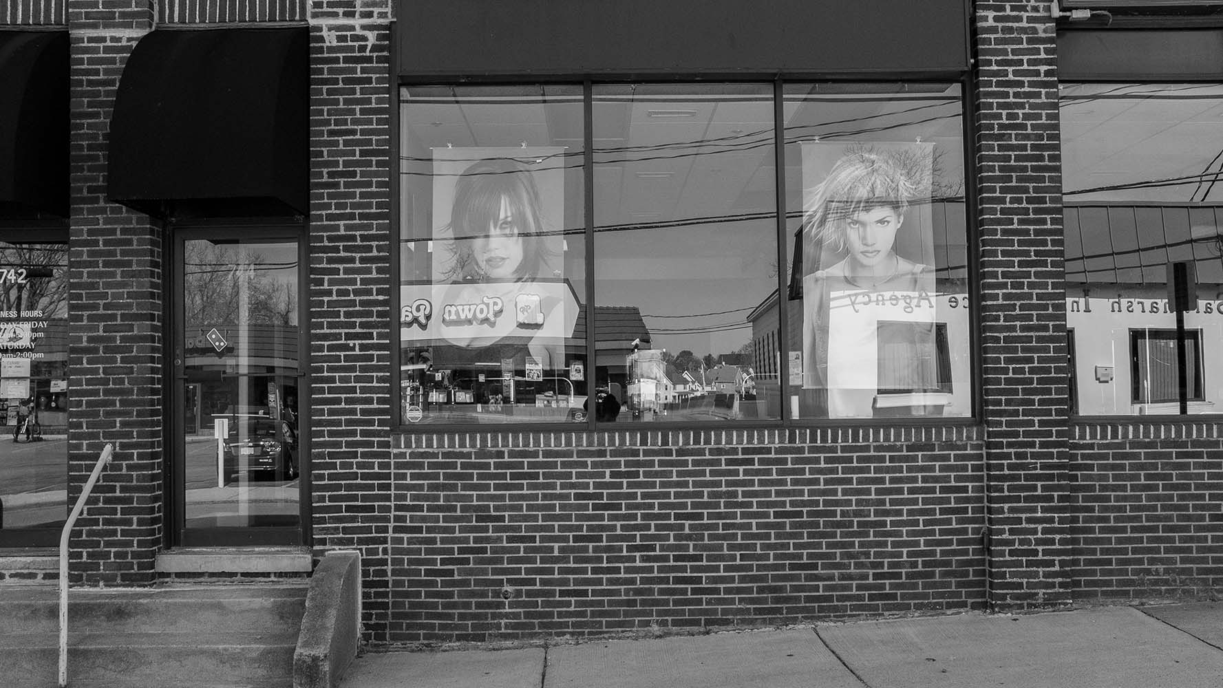 closed haircut shop window in black and white