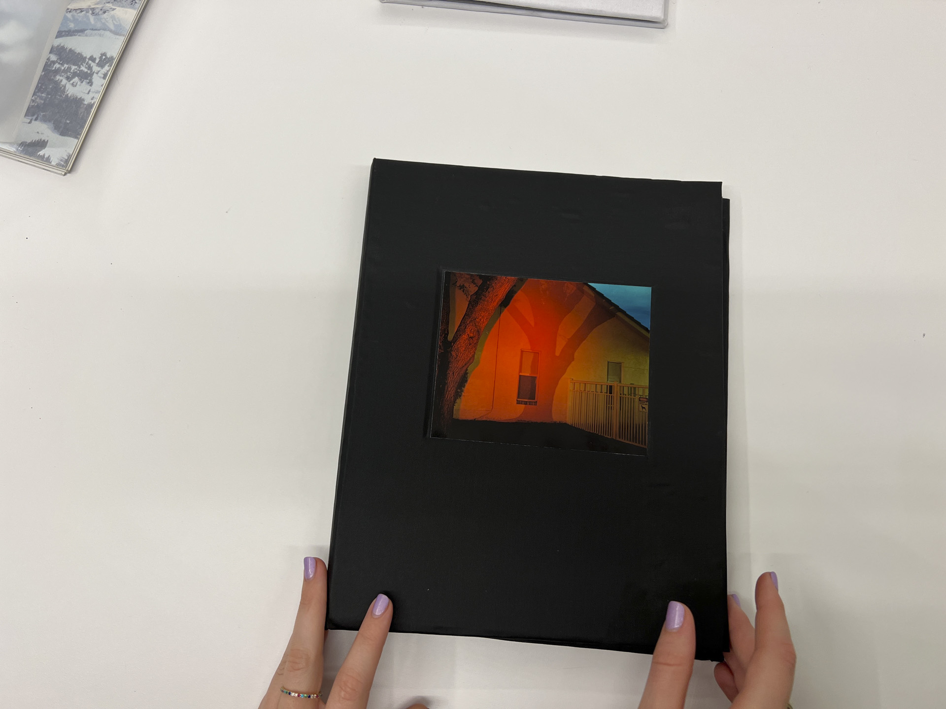 photo of black book cover with color image