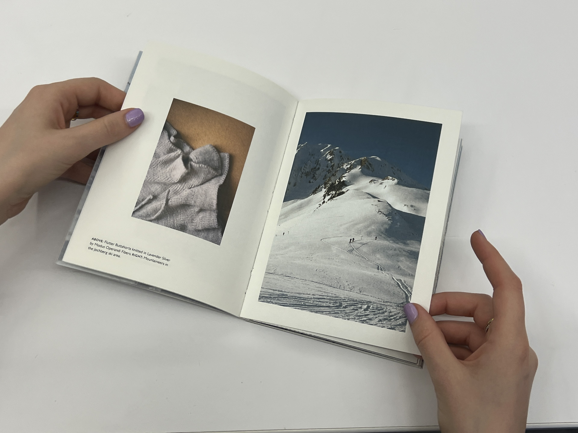 book opened to photos of knitted clothing vs mountain covered in snow