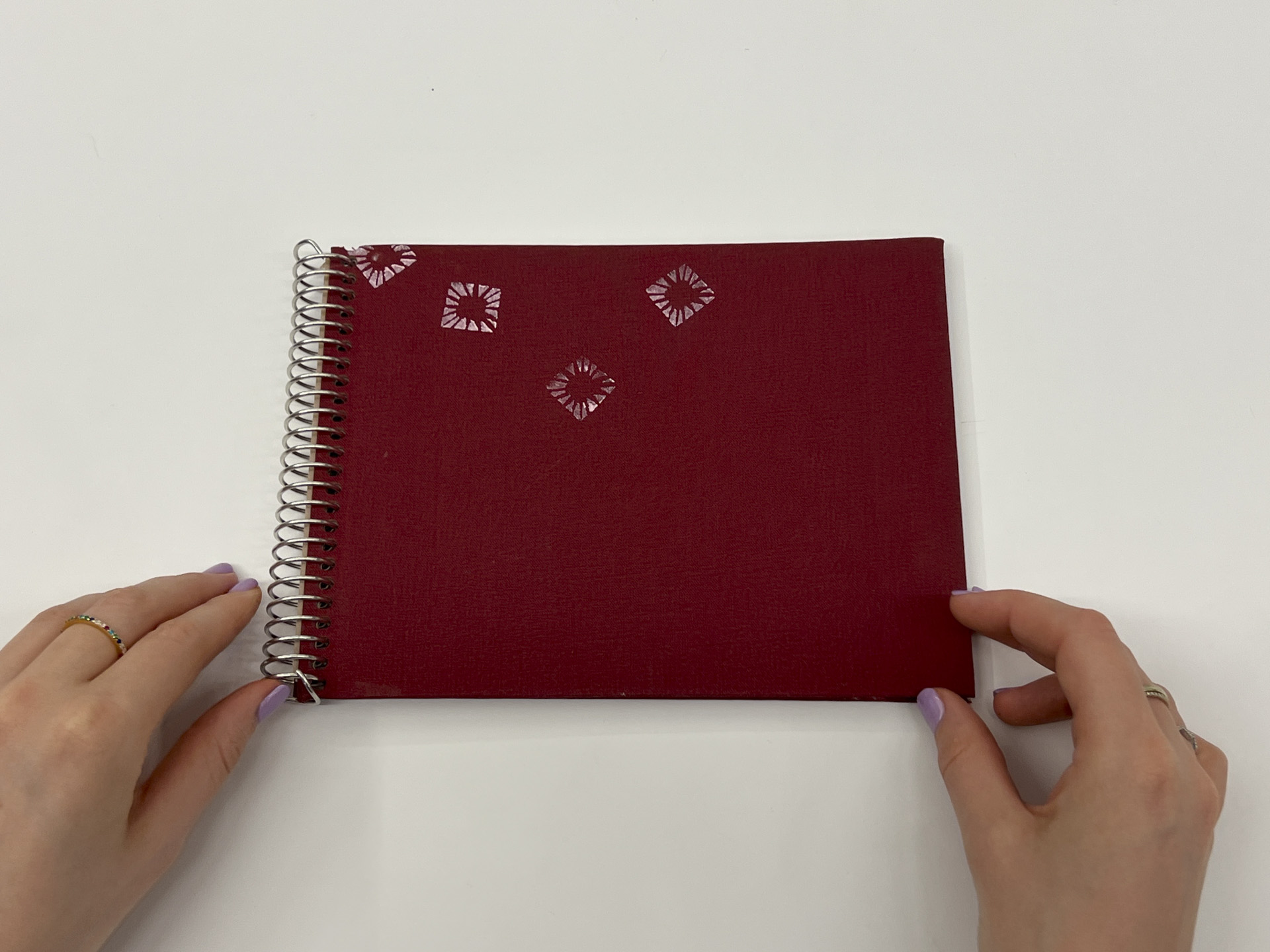 photo of red book cover with ornamental pattern