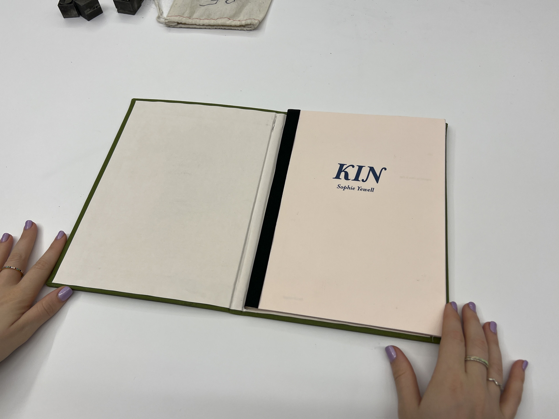 photo of interior of book with text stating "kin sophie yewell"