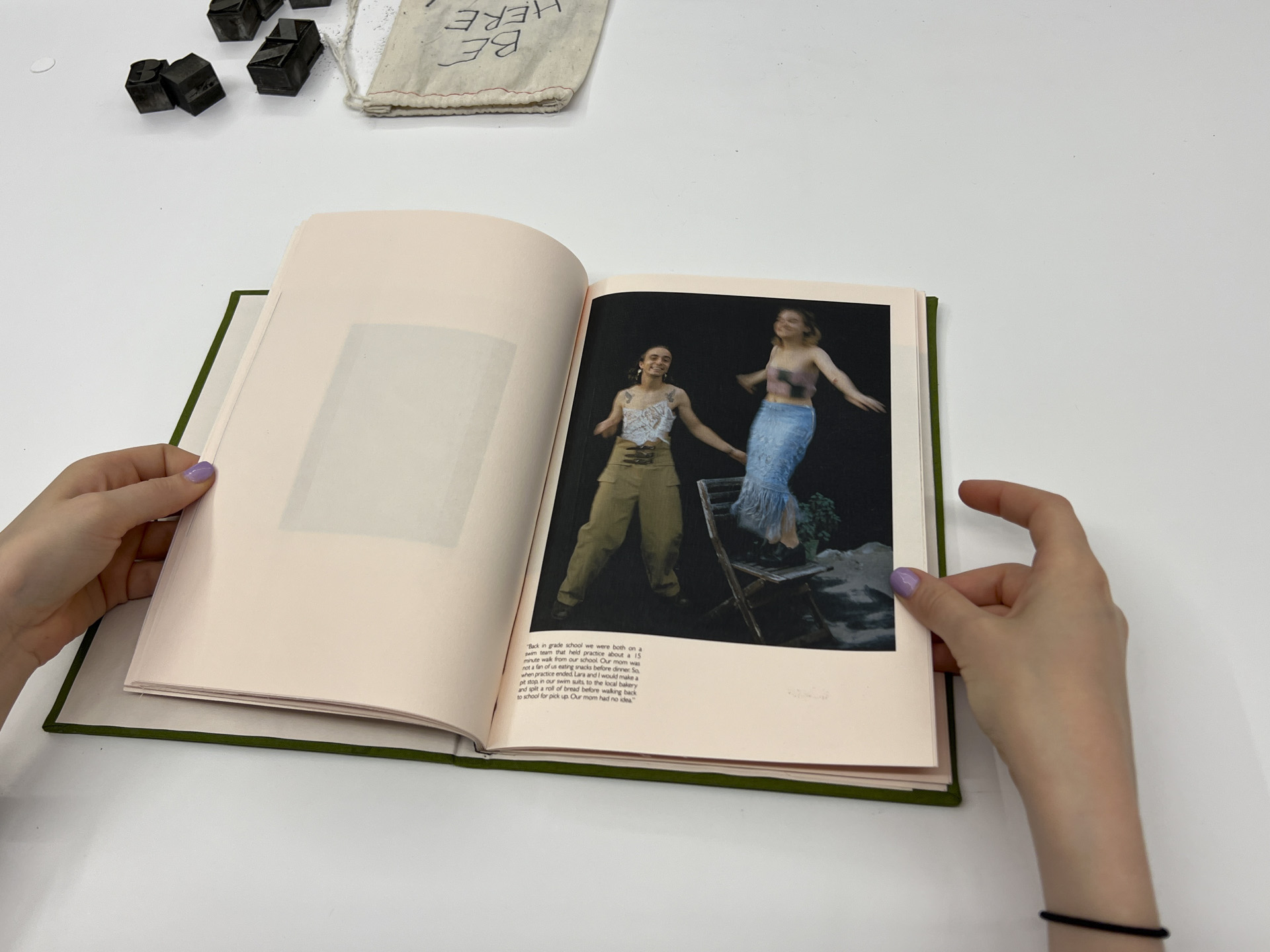 photo of interior of book with portrait of two people 