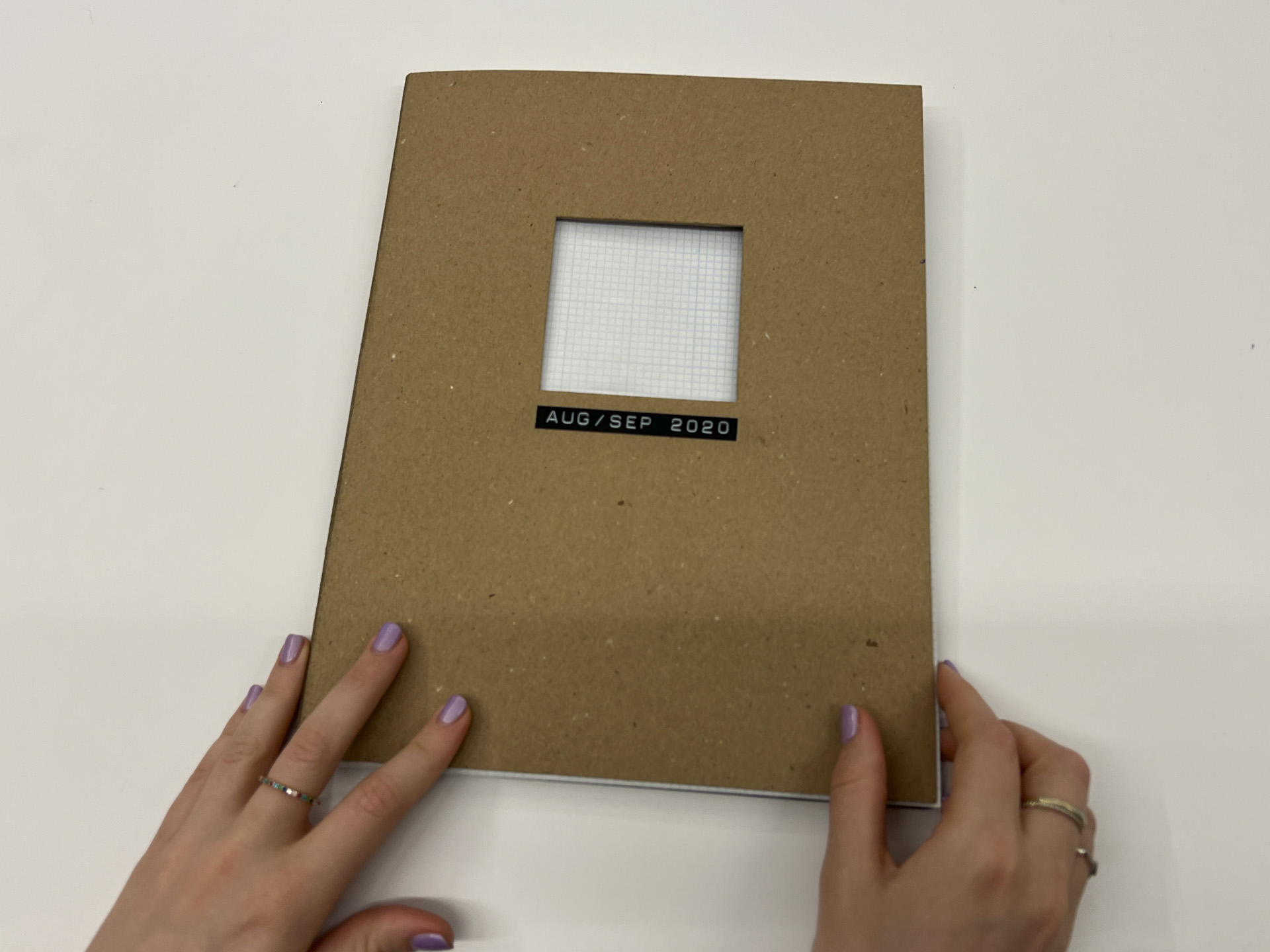 photo of a brown book cover with text "aug/sep 2020"
