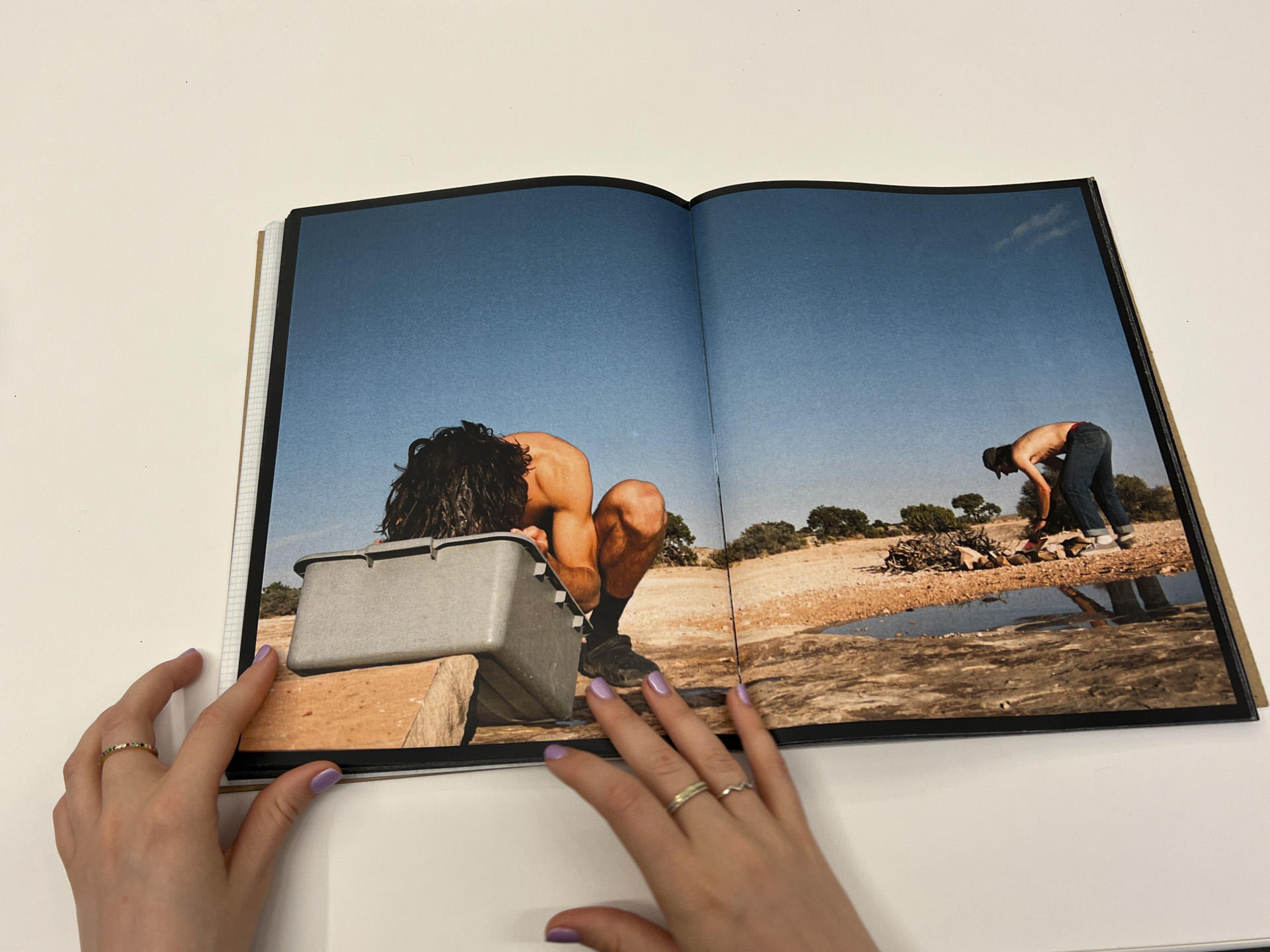 photo of book opened to an outdoor scene