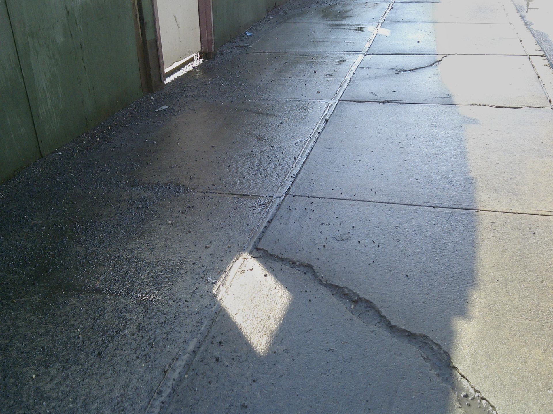 exterior scene with broken concrete pavement