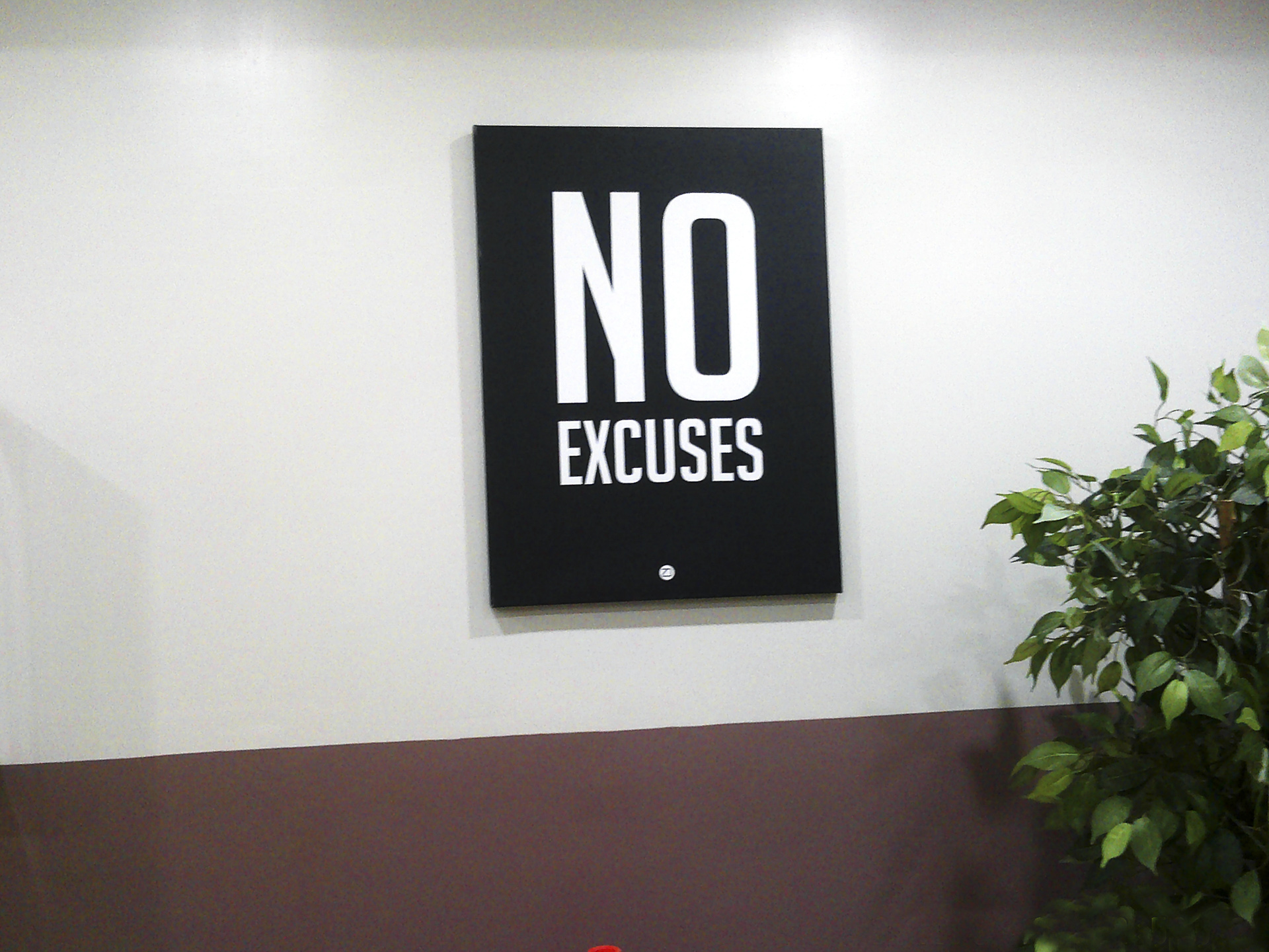 internal shot with poster stating words "no excuses"