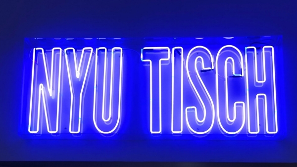 Neon sign that reads NYU Tisch