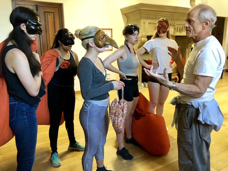 Jim Calder with students wearing various Commedia masks in Florence, Italy