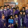 A group of graduates with their caps and gowns.