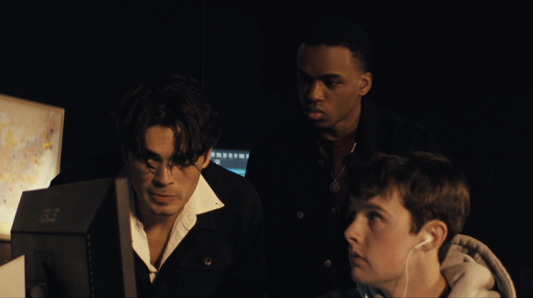 Two people on a film set with camera equipment.