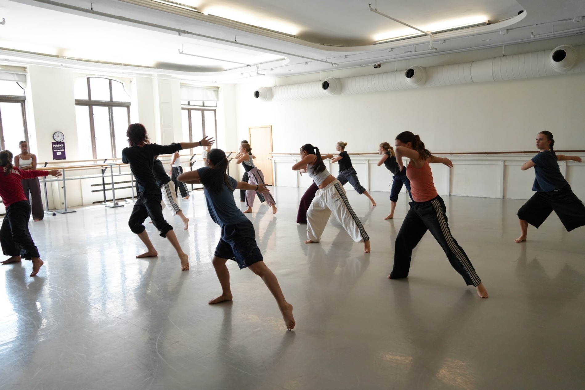 Group of dance students training in a rehearsal studio
