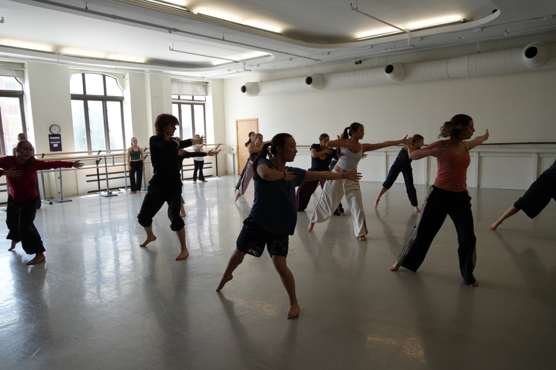 Group of dance students training in a rehearsal studio