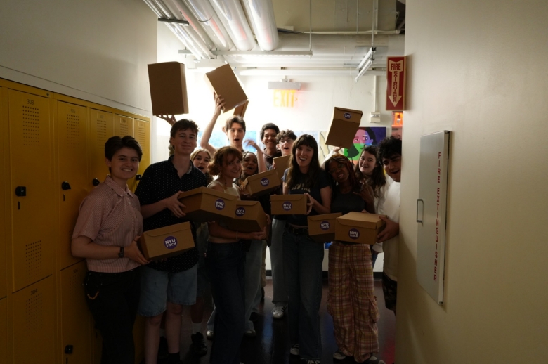 Students posing with boxes during Production and Design workshop