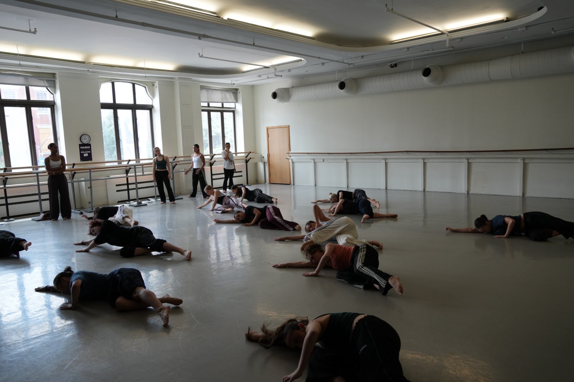 Group of dance students training in a rehearsal studio