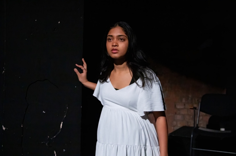 Actress staring into the distance during a scene from the Spring 2026 final presentation of "Measure for Measure".