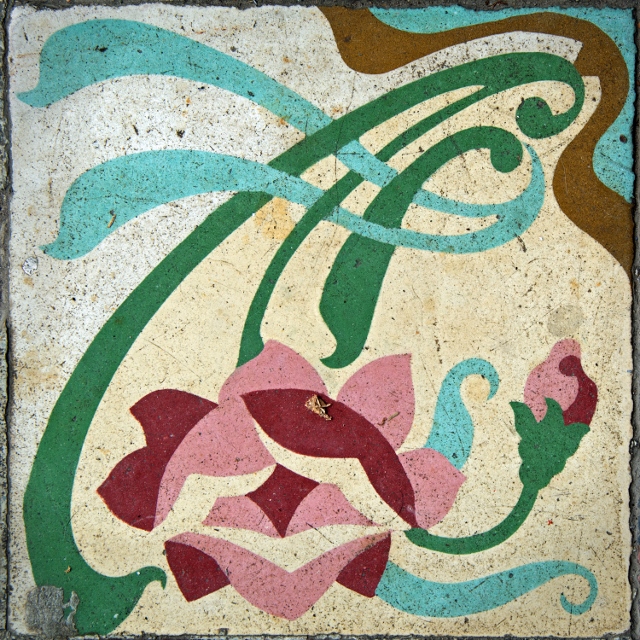 Colorful florals painted on ceramic tiles.