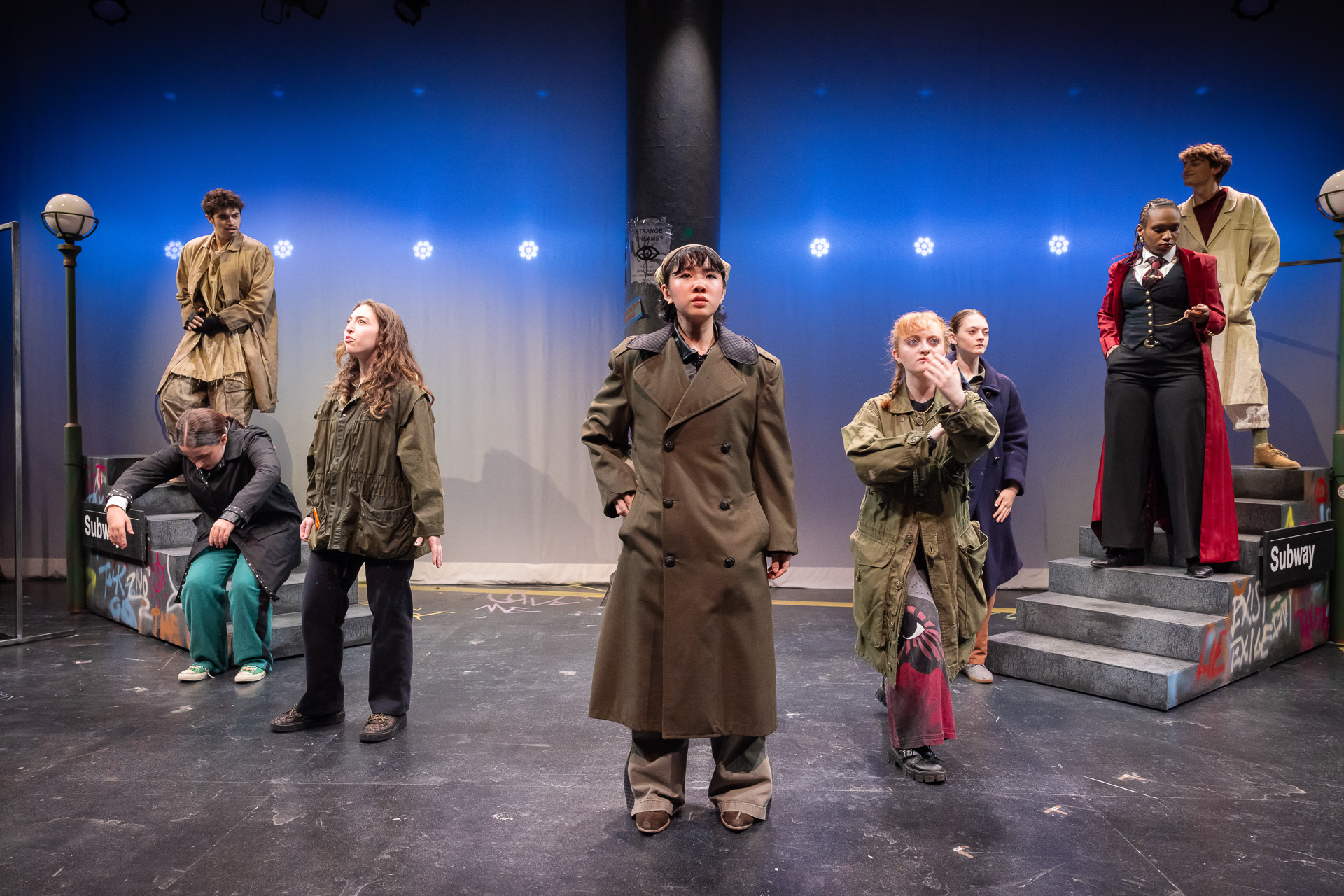 several people standing on a stage