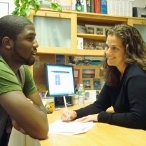 Tisch counselor meets with student