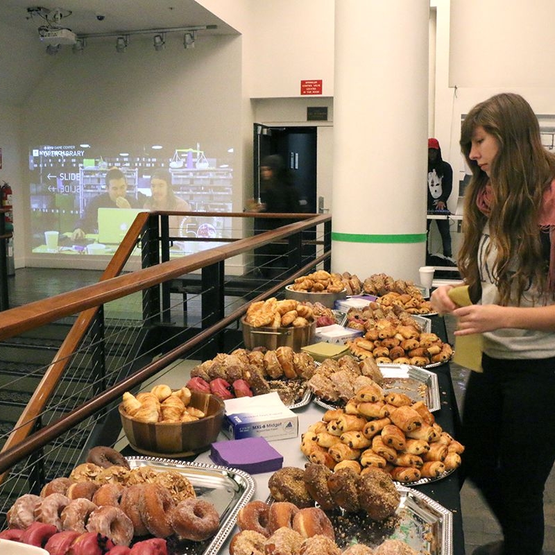 person with a platter of breakfast foods 