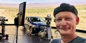 Instructor, Noah Kadner, stands in front of a camera on an LED Stage
